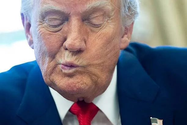 U.S. President Donald Trump speaks after signing an executive order in the Oval Office of the White House on April 9, 2025, in Washington, D.C. Photo by Saul Loeb/AFP
