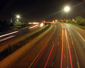 highway car tail lights, light streaks, long exposure at night