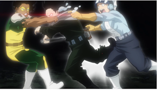 The heroes Rocklock and Manual trying to pull Izawa out of the way as the Quirk destroying pullet hits his leg. Aizawa's eyes are burning with red light, and the water Manual is directing at his eyes to moisturize them, and he has a knife in his hand.