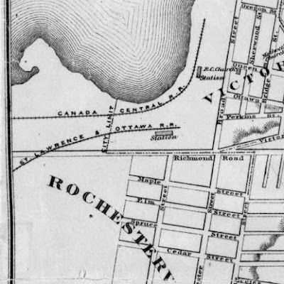 Section of an 1874 map at the west end of Ottawa, with extent Bridge/Division Street (Booth, East), Eccles Street (South), West of City Limits (West), Oregon St (just south of Ottawa River at Booth, North). Richmond Road crosses the entire section of map. The City limit comes northbound from the bottom of the map up Division Street, turns west (left) on Richmond Road, then turns north (right) west of Broad Street in the middle of nowhere, opposite where Champagne Ave (City Centre Ave) will later be (but nothing is drawn west of Preston). Two rail lines come in from the west: The Canada Central R.R. (C.P.R.) along the Ottawa River which turns north around Nepean Bay to become parallel with Broad Street, where there is a station between Queen and Ottawa streets. The other rail line, St. Lawrence & Ottawa R.R. (C.A.R.), comes onto the map just south of Richmond Road and crosses it at a shallow angle before arriving at its station west of Broad opposite Preston Street, just inside City Limits. Outside City Limits, Rochesterville is labelled as the area west of Division and south of Richmond Road.