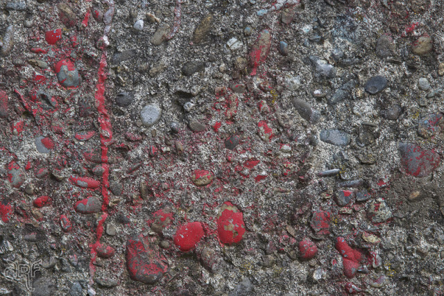 red paint on old concrete