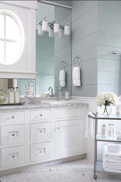 white vanity marble gray wood paneled walls