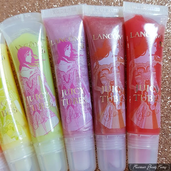 fashion designer illustrated tubes of Lancome lipgloss in row