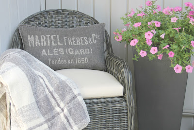 Gorgeous wicker Davies chair (Decor Market) on front porch - Hello Lovely Studio