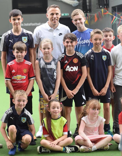 Gary Neville and kids in football kids