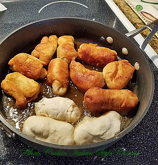 Delicious stuffed pizza dough, fried and dipped in marinara sauce