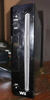 Black Nintendo Wii showing the front panel