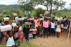 Dozens of children from Zambia excited to open their Operation Christmas Child shoeboxes.
