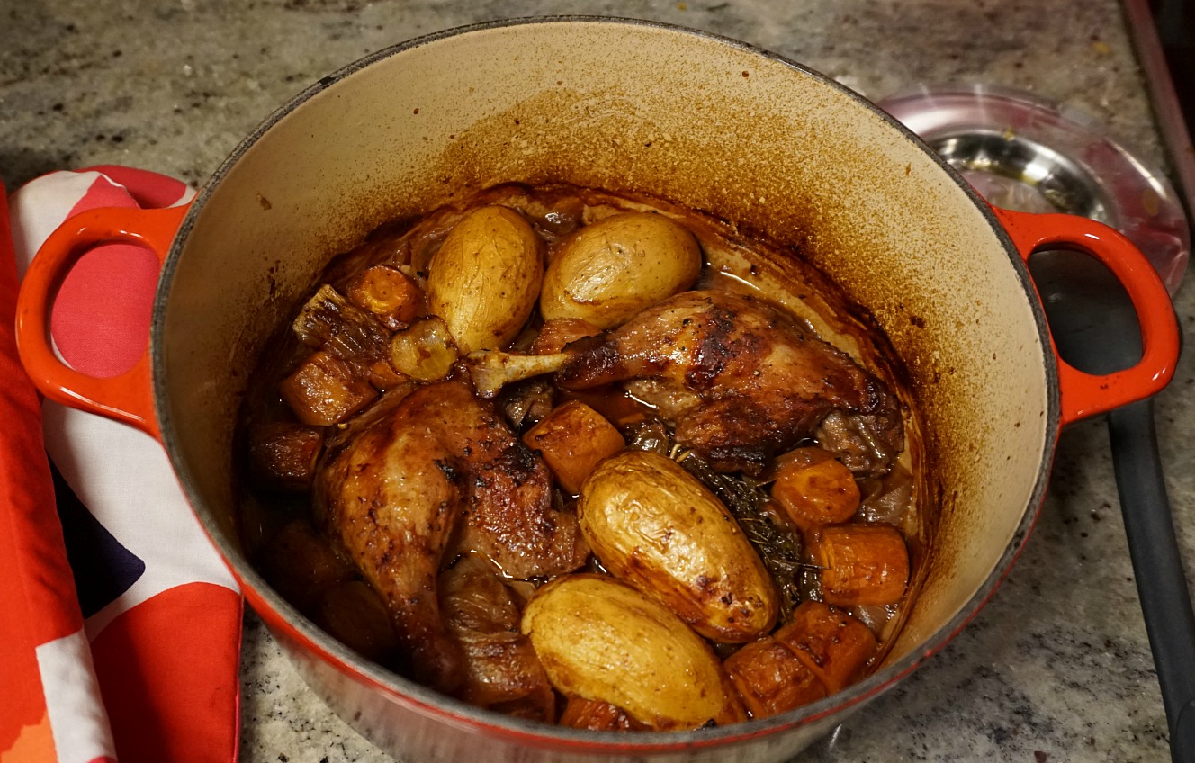 Duck legs en cocotte with carrots potatoes and onionsDuck legs en cocotte with carrots potatoes and onions