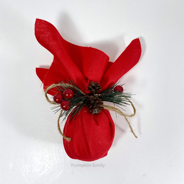A red fabric Christmas ornament.