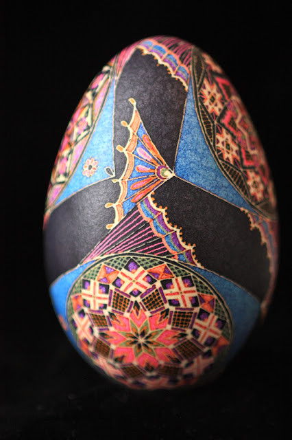 Goose Egg Pysanky with Colorful Tropical Fish on Black Background in Interlocking Pattern