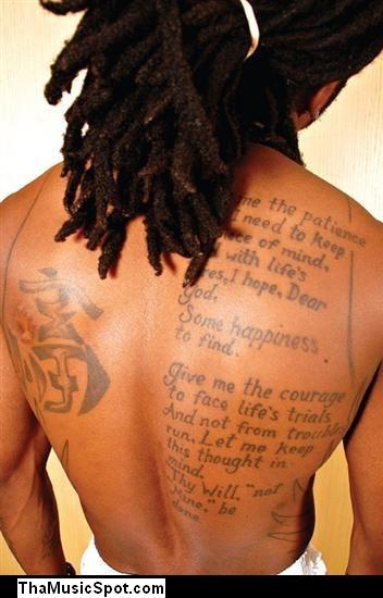 Pistol tattoo on his neck A Gun tattoo on his hand Lil' Wayne feels a
