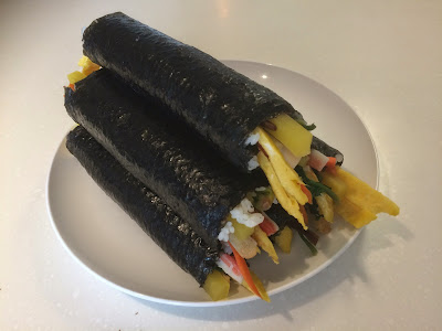 chungmu gimbap classical cooked rice danmuji gwangjang market kimchi korean food Korean Foods mayak gimbap samgak gimbap seaweed paper seoul sesame oil South Korean yellow picked radish