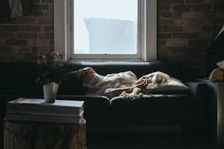 Woman sleeping on a sofa