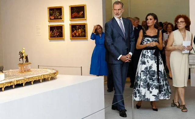 Queen Letizia wore a new floral bow a-line cocktail dress by Carolina Herrera. King Felipe and Prime Minister Pedro Sanchez