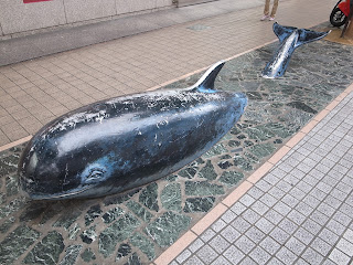 whale buried in pavement