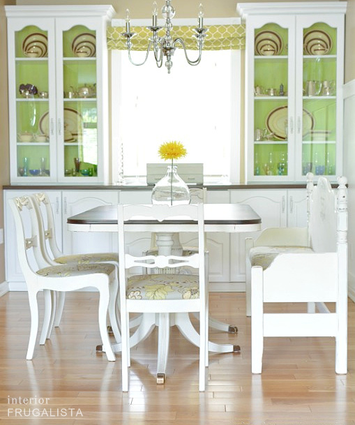 A DIY dining room makeover painted white to brighten the space.