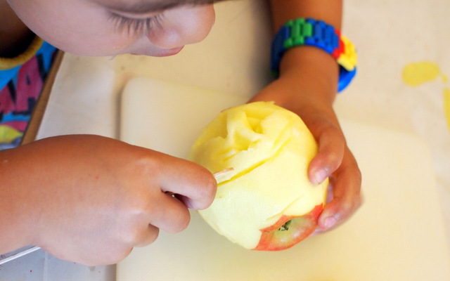 Use a popsicle stick to cut out your faces from apple heads