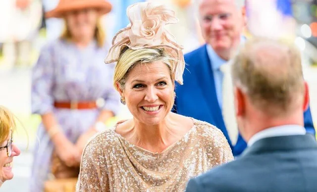 Queen Maxima wore a sequin skirt and blouse by Natan, and a hat by Fabienne Delvigne. Gianvito Rossi pumps