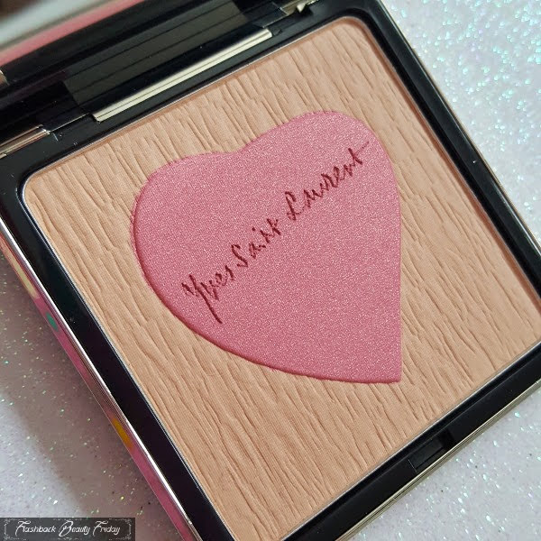 limited edition face powder close up with Yves Saint Laurent heart in centre