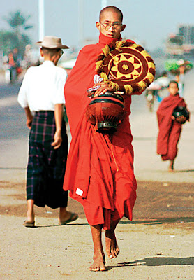 Monk walking in Yangon to find food