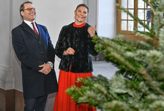Crown Princess Victoria wore a faux fur jacket by Filippa K. Red pleated dress by Andiata. Acne nova floral print pumps, shoes
