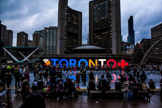 Many people in the streets of Toronto.