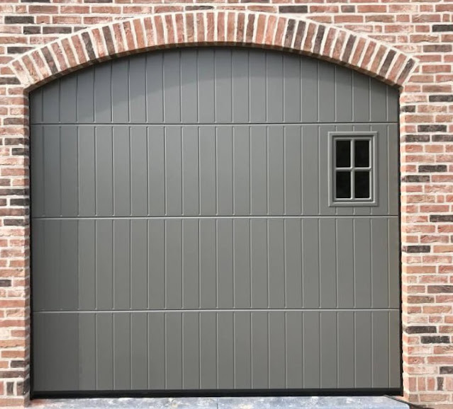 Garage door - okoume plywood cladding with window