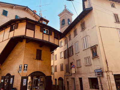 Via Pignolo Alta, Piazzetta del Delfino with Sant'Alessandro looking down from the belltower, powerless to do anything.