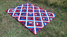 Red, white, and blue batik string quilt