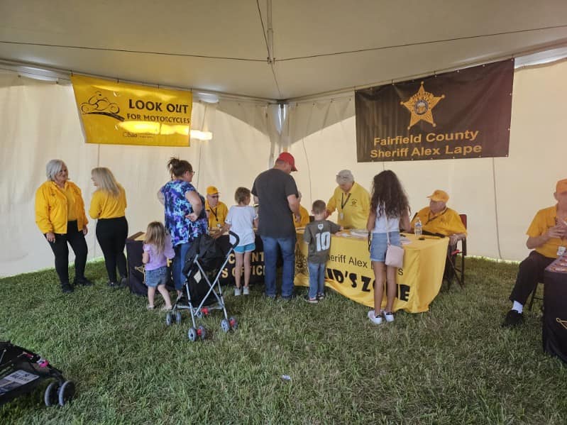 sheriff table at the sweet corn festival