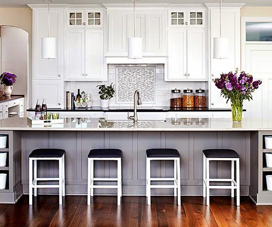 traditional white kitchen with black bar stools white pendant lighting green purple accents