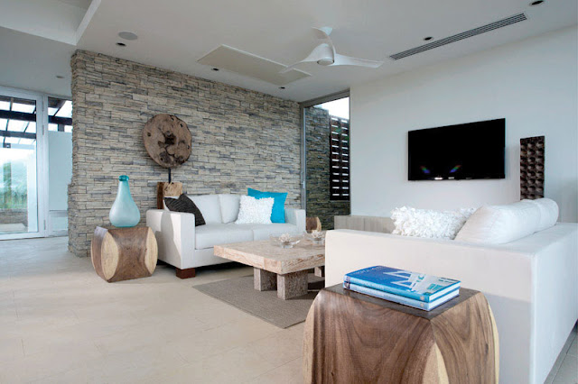 Modern white sofa and wooden tables 