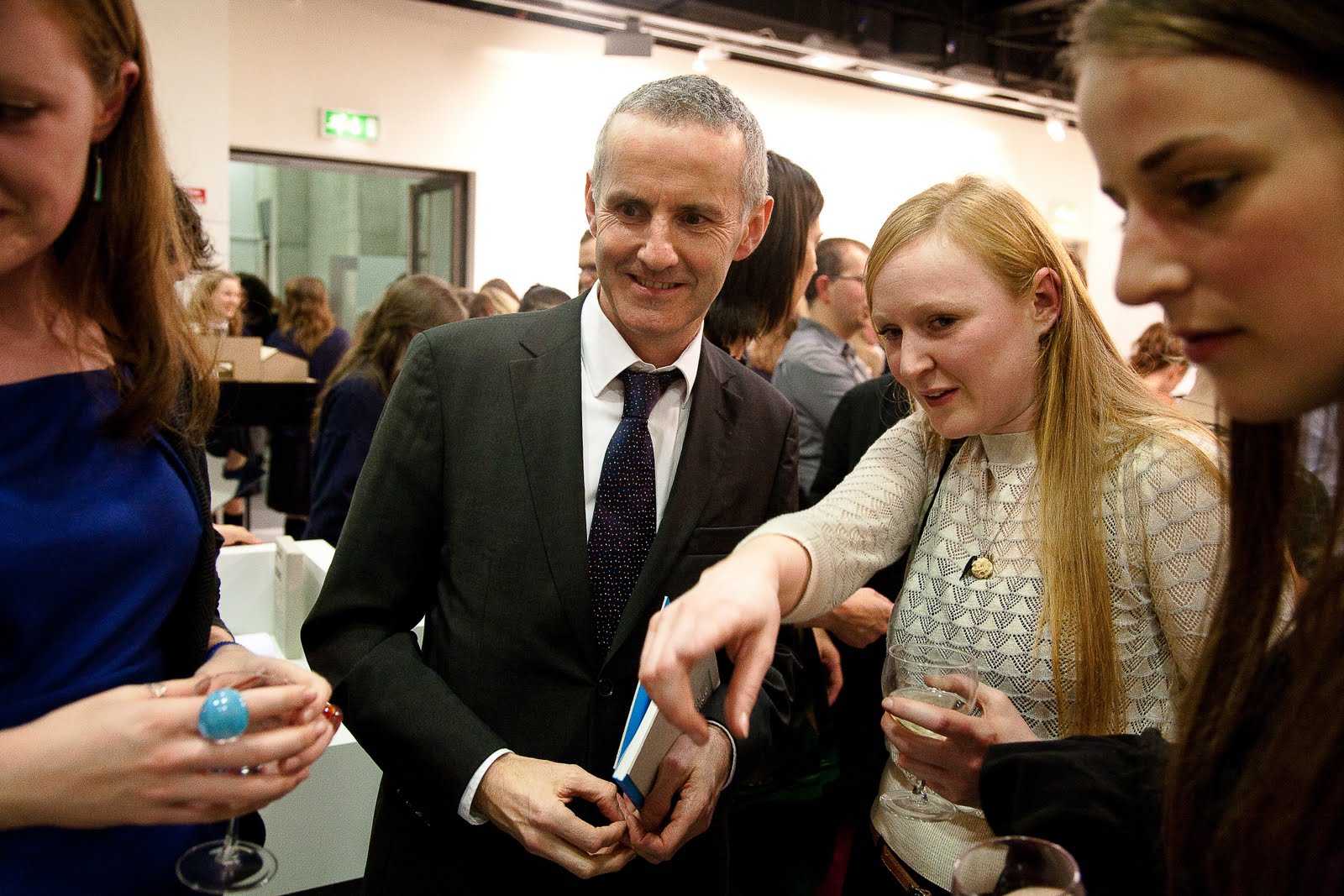 Faela Guiden showing Minister Ciarán Cuffe their exhibit. You can  title=