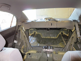 Interior of car looking from the driver's seat through to the trunk with new floor and rear installed.