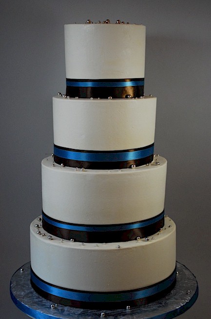 ROYAL BLACK AND BLUE AND SILVER WEDDING CAKES