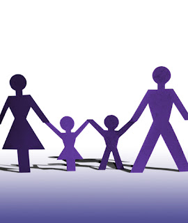 image of family of two parents and two children holding hands.