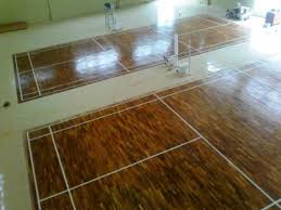 Pemasangan Lantai  Kayu Parket Untuk Lapangan Badminton  