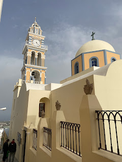 Belltower and dome of Saint John the Baptist Catholic Church in Thira Santorini
