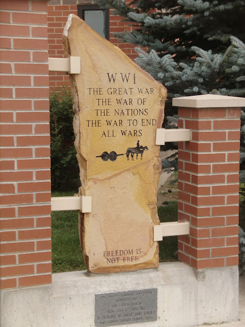 stone tablet held in place with two brick collums