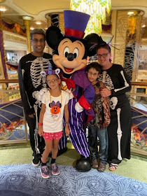 Family with Mickey Mouse in Halloween costumes