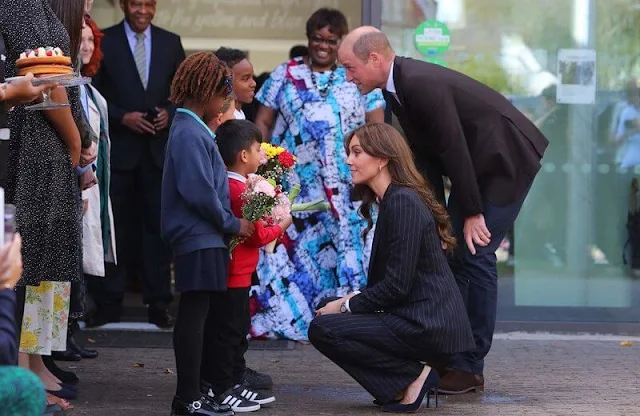 Princess of Wales wore a double-breasted stripe suit and a Cupro shirt bodysuit by Holland Cooper. Shyla earrings