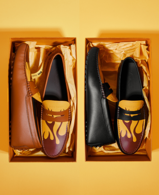Photo of 2 pairs of Tod's x Moncler x Palm Angels Loafers in their original boxes. Both colourways of the shoes are presented, one base colour is black and the other is brown. Picture is shot against a yellow backdrop