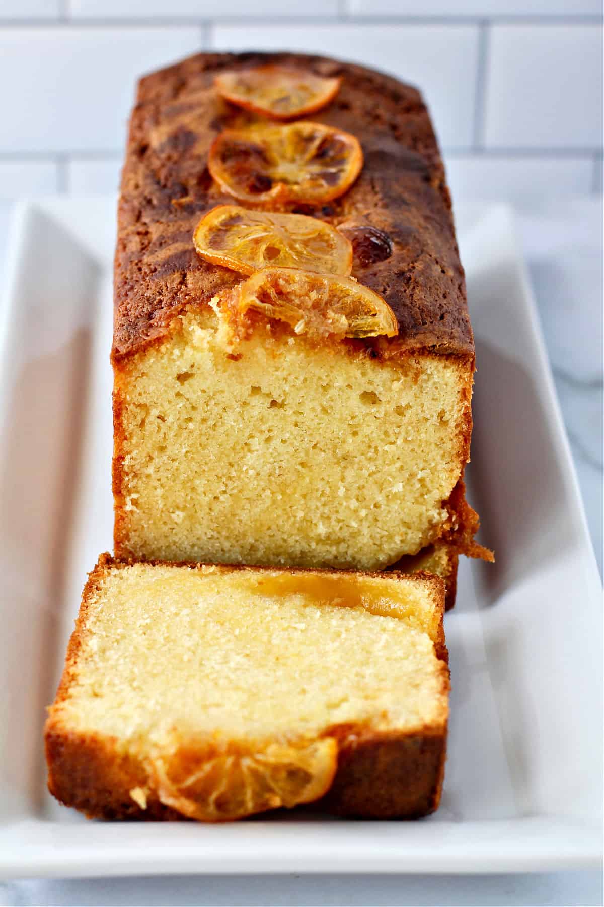 Lemon-Curd Pound Cake with candied lemons on top.
