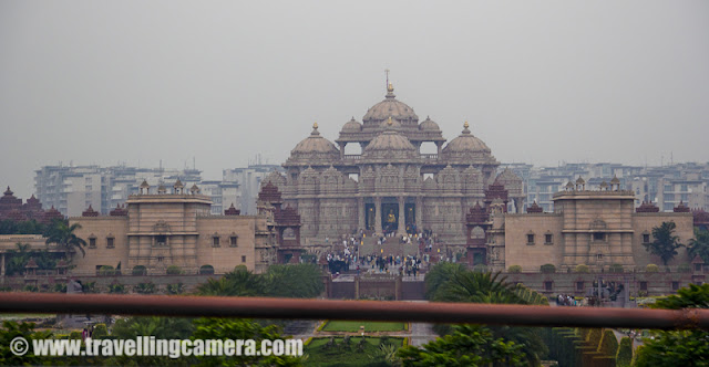 Photography and shooting videos inside Metro is not allowed but one can click photographs of things outside Metro... Many times I see beautiful Akshardham Temple from Metro and since Cameras are not allowed inside, I thought of capturing it through Metro only ...A quick glance at Akshardham Temple from Metro train at Delhi, INDIA !!! Although these pics are shaky...Flyovers near Akshardham temples have made drive easy for people who come via cars... All thanks to Common Wealth Games. Although many corrupt people dumped our money at unknown places, but infrastructure has improved a lot !!!Anyway, speed of improving infrastructure is less than population of our country !!! So this photograph shows heavy jam on same flyovers which helped in reducing traffic during Common Wealth Games .... Same thing is with Metro train.. Initially everyone thought that it will reduce some traffic on roads, but now Metro is also overloaded as we see Delhi-Roads...Anyways Akshardham is a lovely place and good place to hang out with your family and friends... I always recommend light and music fountain show which happen during evenings.. It's amazing and should be seen once at least....