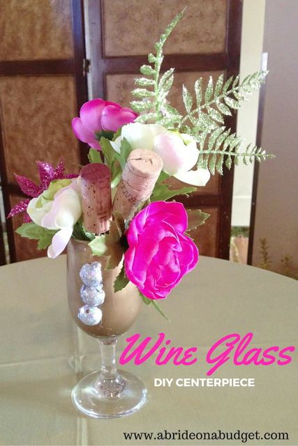 Having a vineyard wedding? Or maybe you just like wine. Check out this Wine Glass DIY Centerpiece on www.abrideonabudget.com.