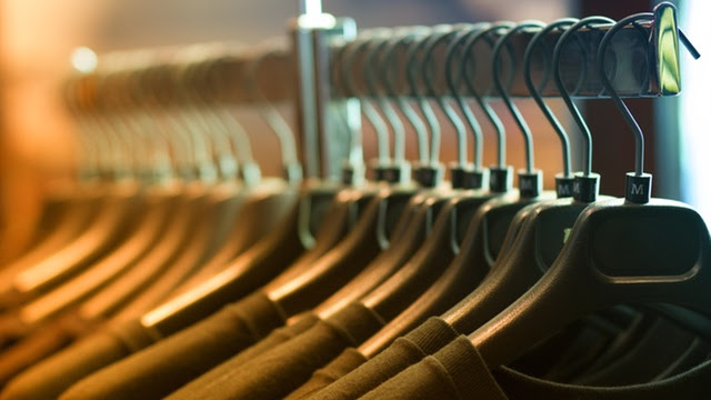 Pile of Shirts Hanged in Shirt Rack