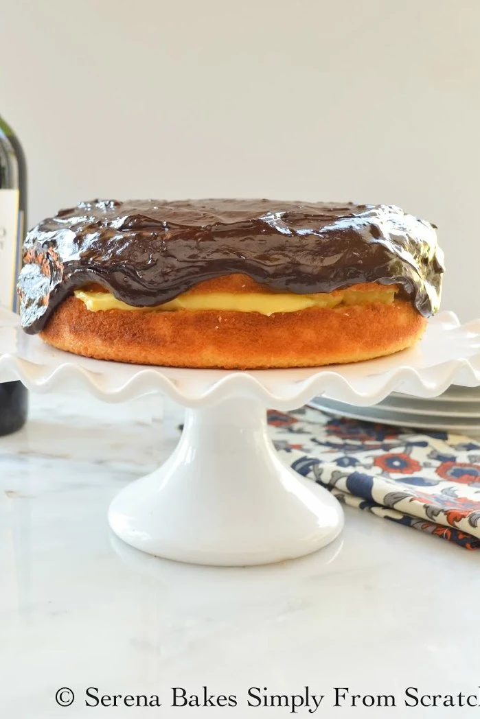 Boston Cream Pie recipe covered in chocolate ganache.