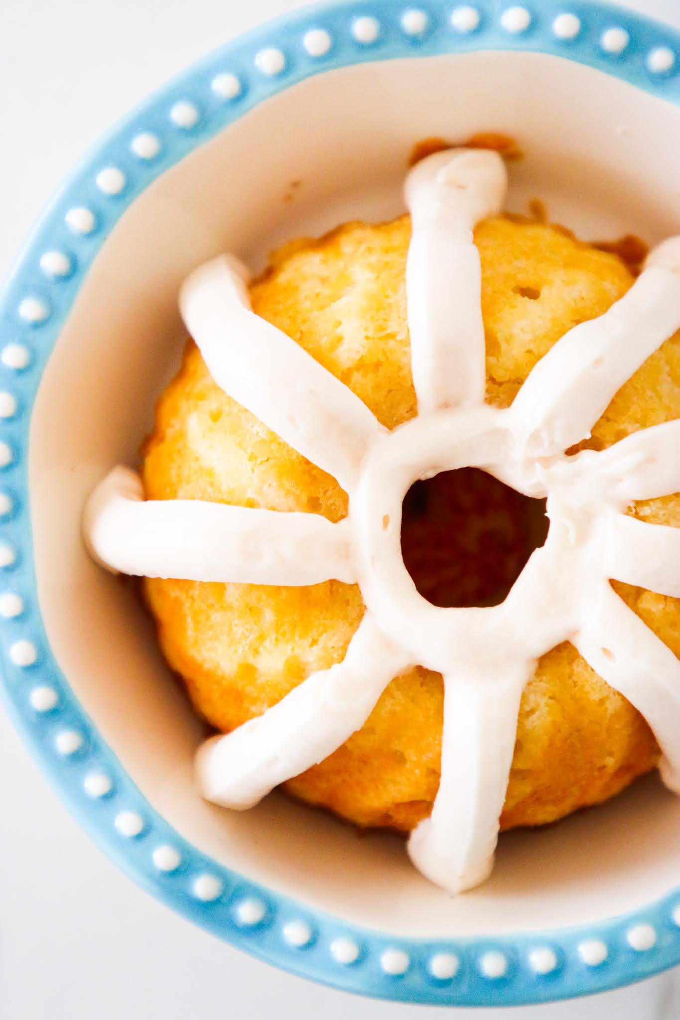 Mini bundt cake with stripes of vanilla icing