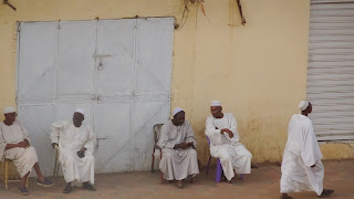 Old people like to sit and wait in streets